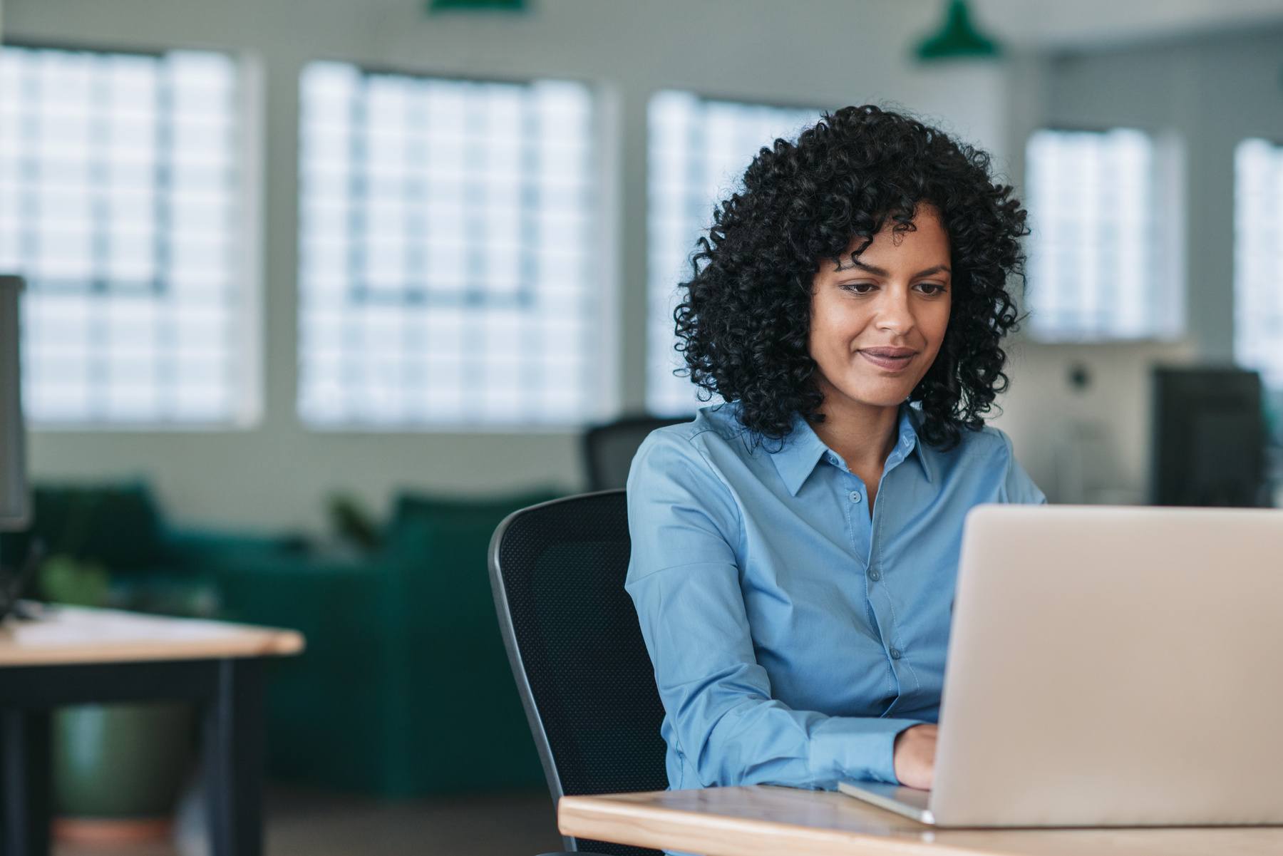 businesswoman hard at work, on her laptop