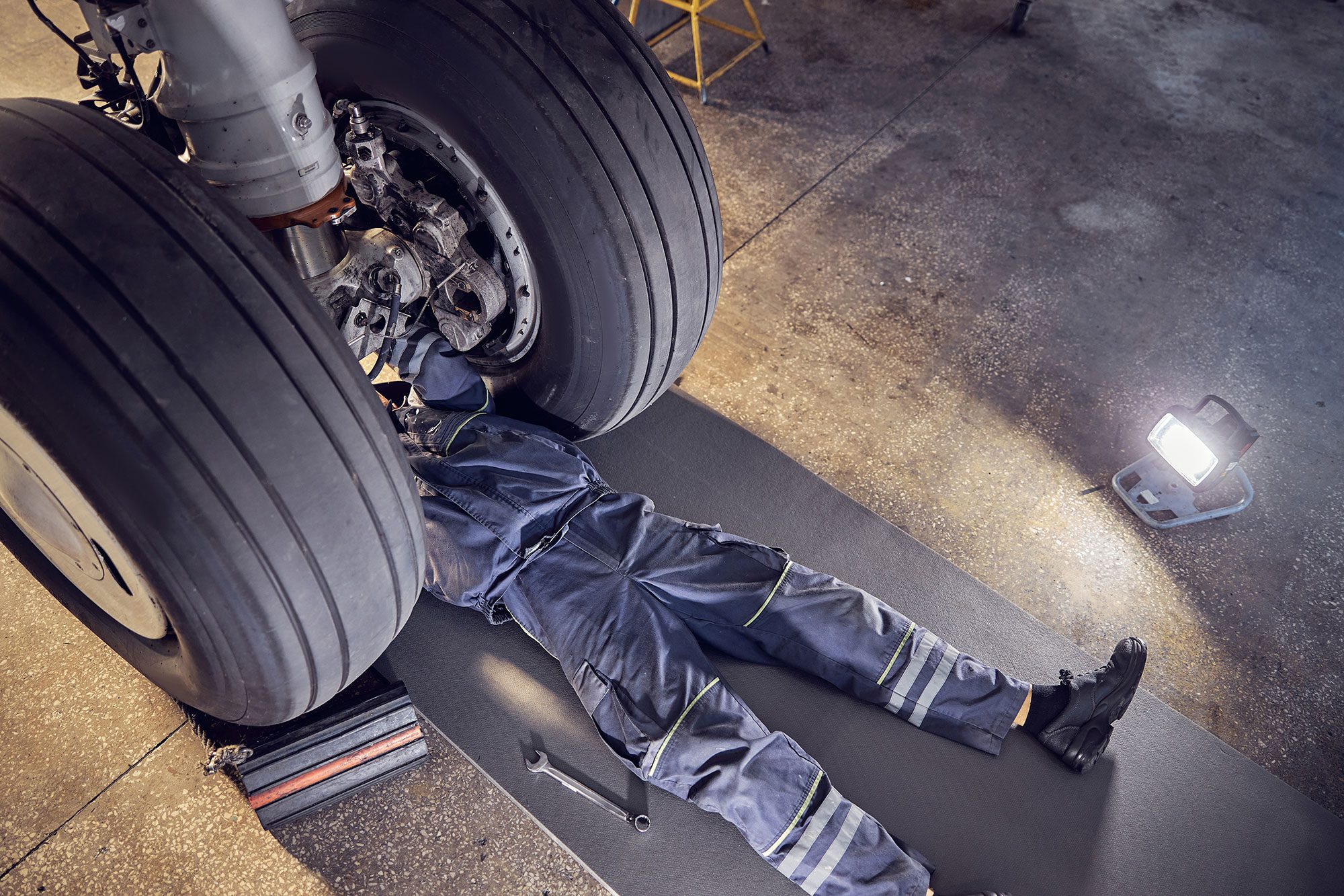 Man working on aircraft wheels
