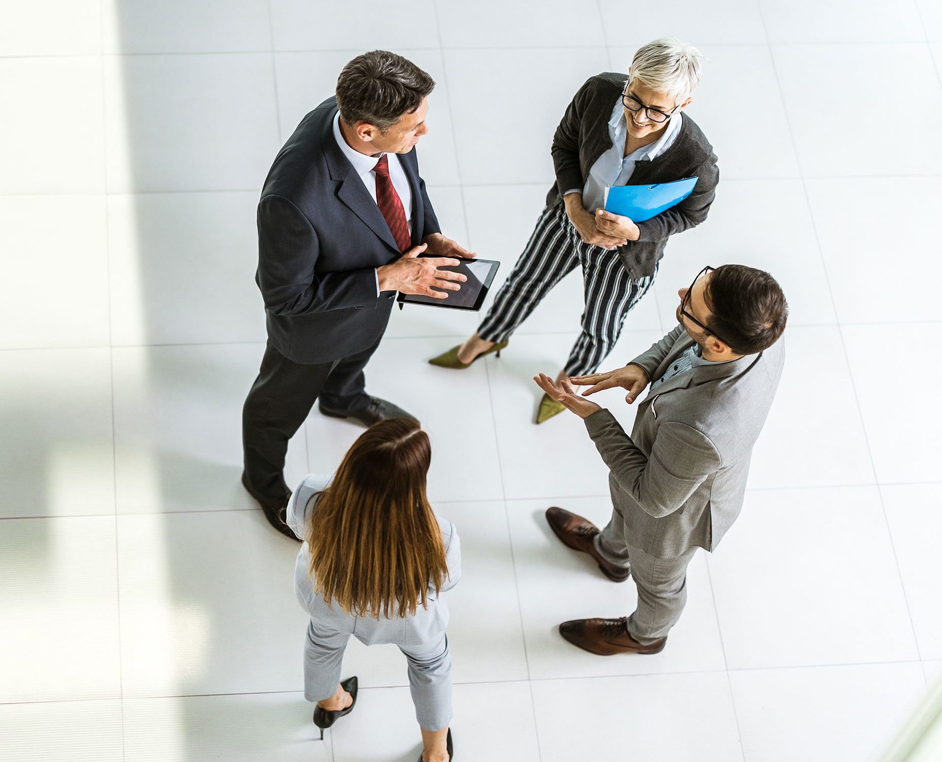 business team talking to car salesperson