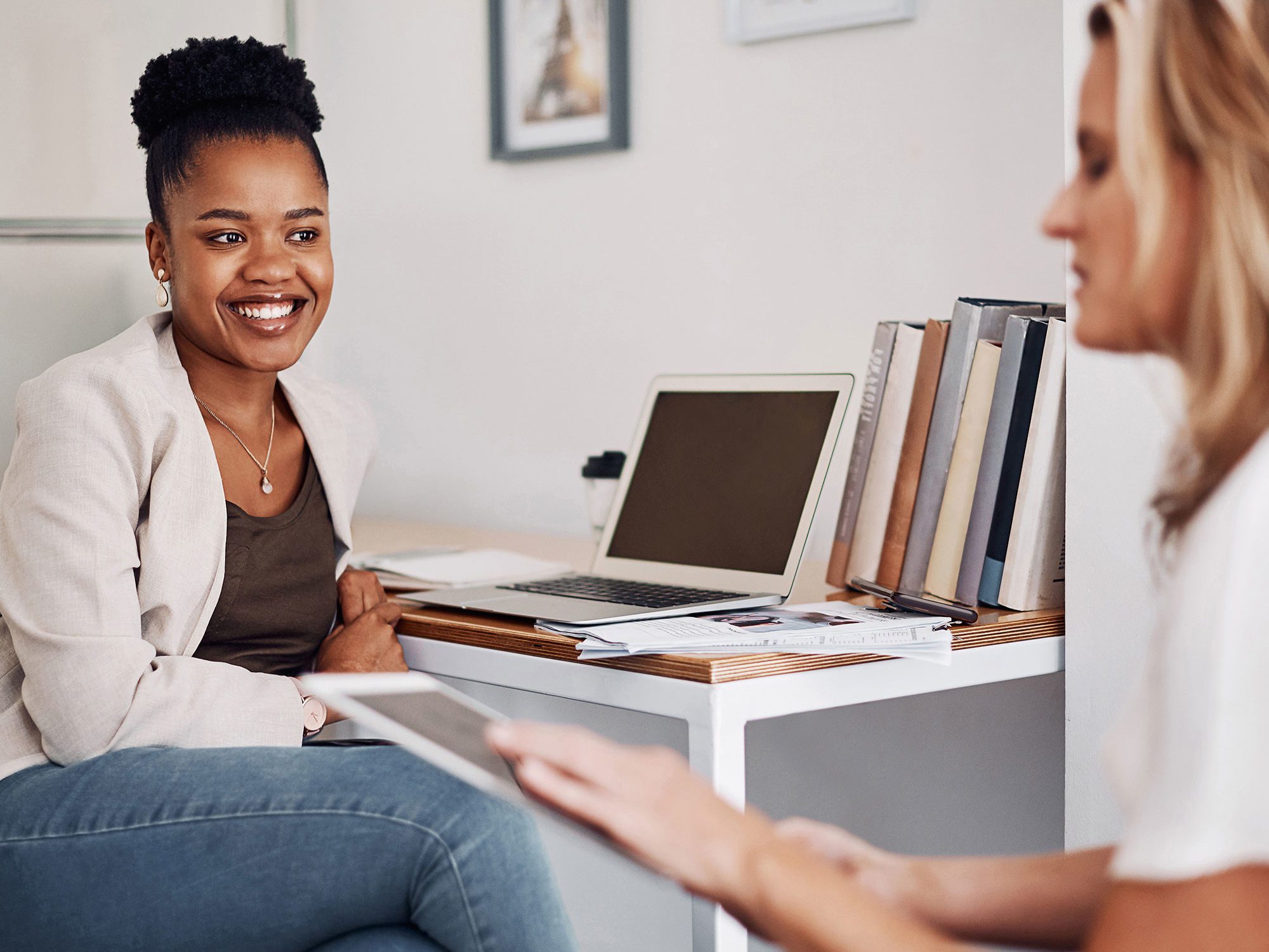 Leader speaking with a team member in an office setting